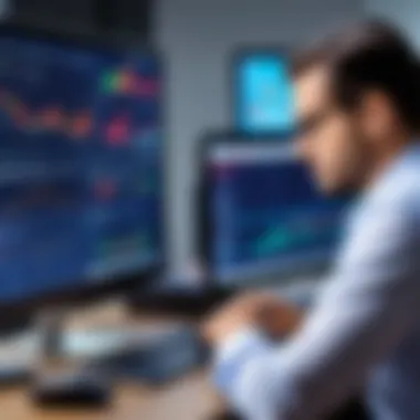 Close-up of stock broker analyzing data on computer screen